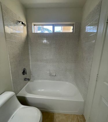 Refinished bathroom with smooth tile surface
