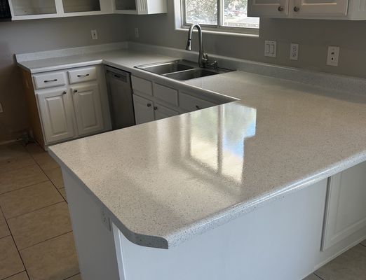 Refinished white kitchen countertops and cabinets