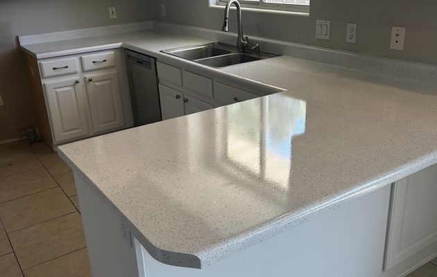 Kitchen countertops refinished white with glossy speckle finish
