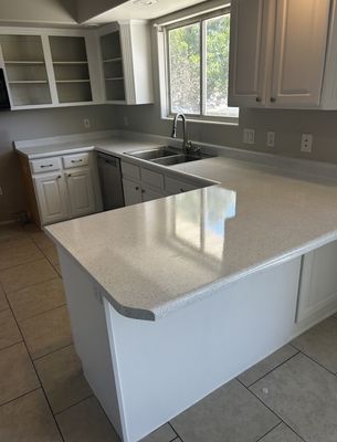 Kitchen countertops refinished white with glossy speckle finish
