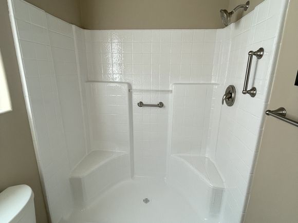 Same shower stall refinished to a bright white finish