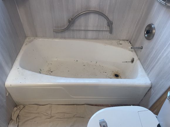 Stained, worn bathtub before refinishing