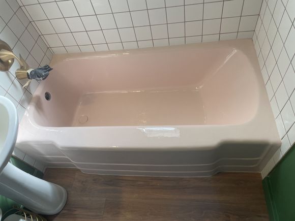 Same bathtub refinished in a custom glossy pink finish