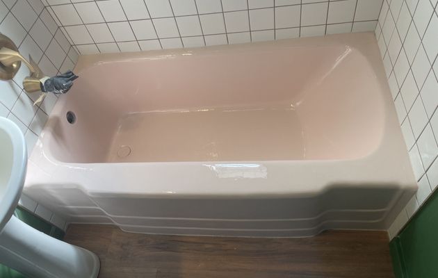 Bathtub refinished in a custom glossy pink finish