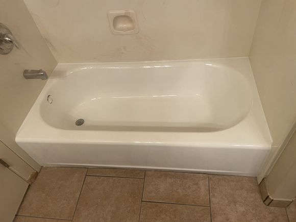Same bathtub restored to a clean white finish