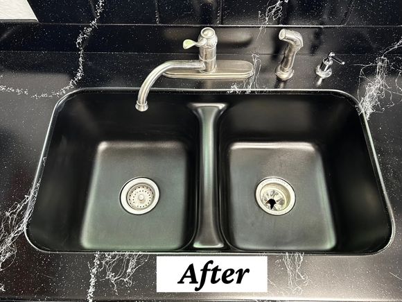 Double sink refinished in black with marble-look countertop