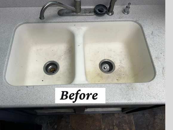 Stained double sink with worn countertop before refinishing