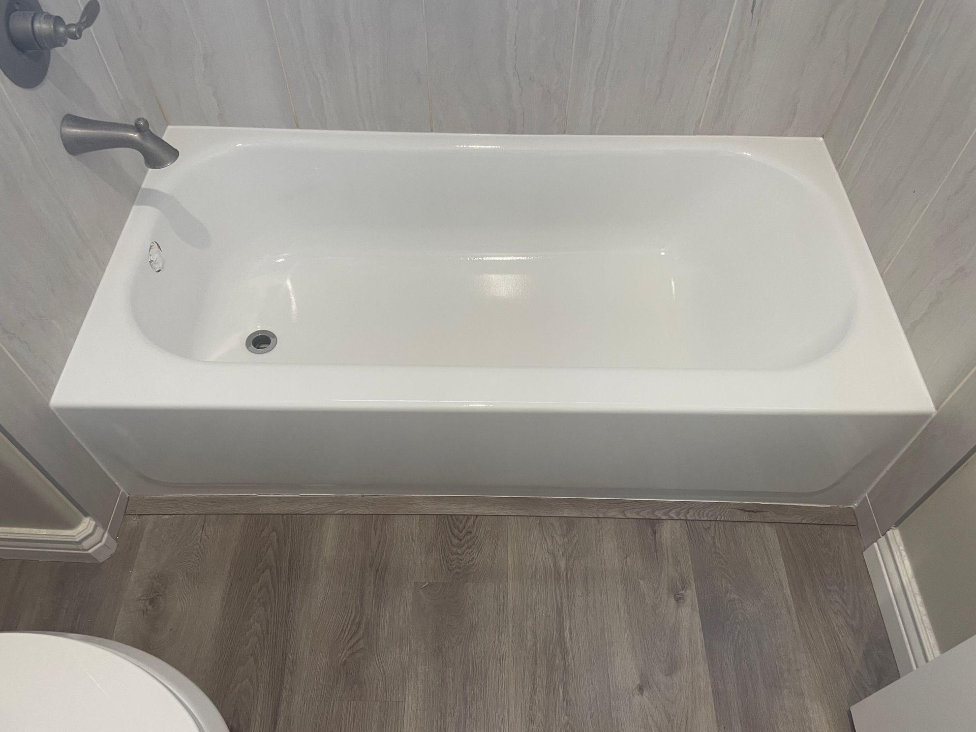 Refinished bathtub with clean white finish