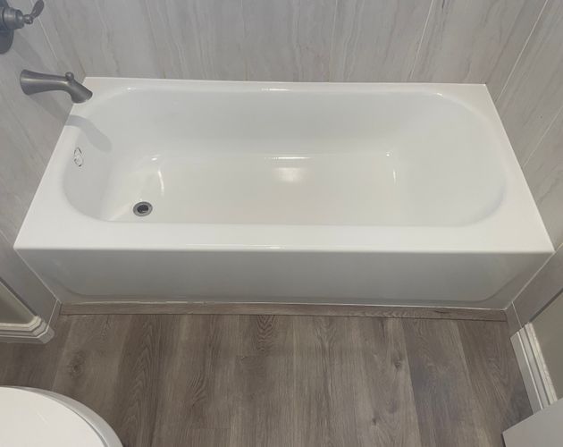 Freshly refinished white bathtub with clean, glossy finish